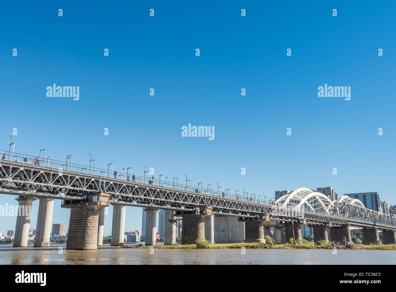 Songhua River Railway Bridge under Autumn Sunny Day in Harbin, China Stock Photo