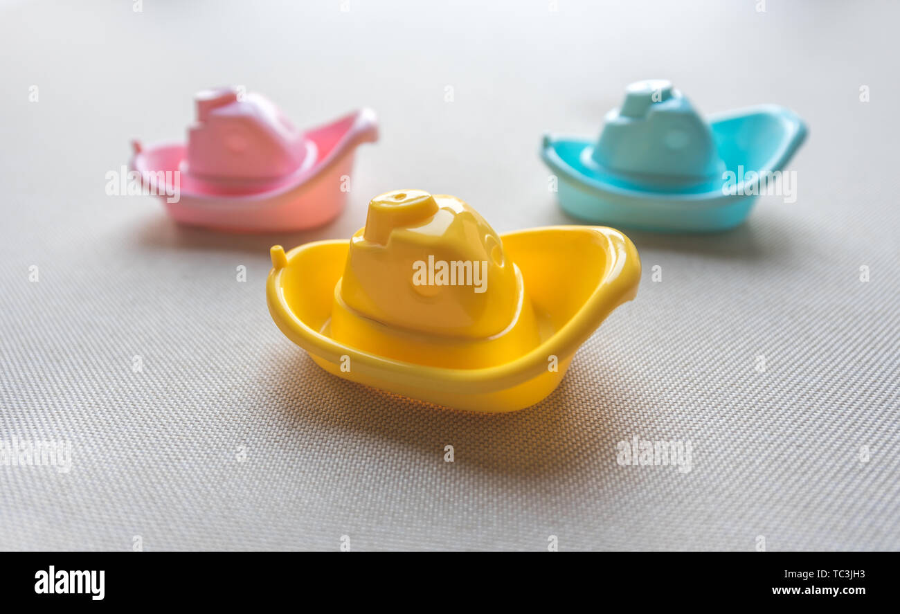 Red, yellow and blue boat toy Stock Photo - Alamy