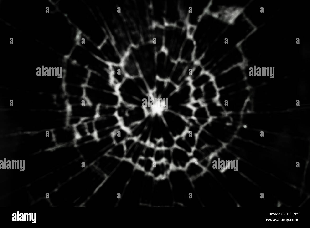 Blurred background in black with a texture of broken glass Stock Photo