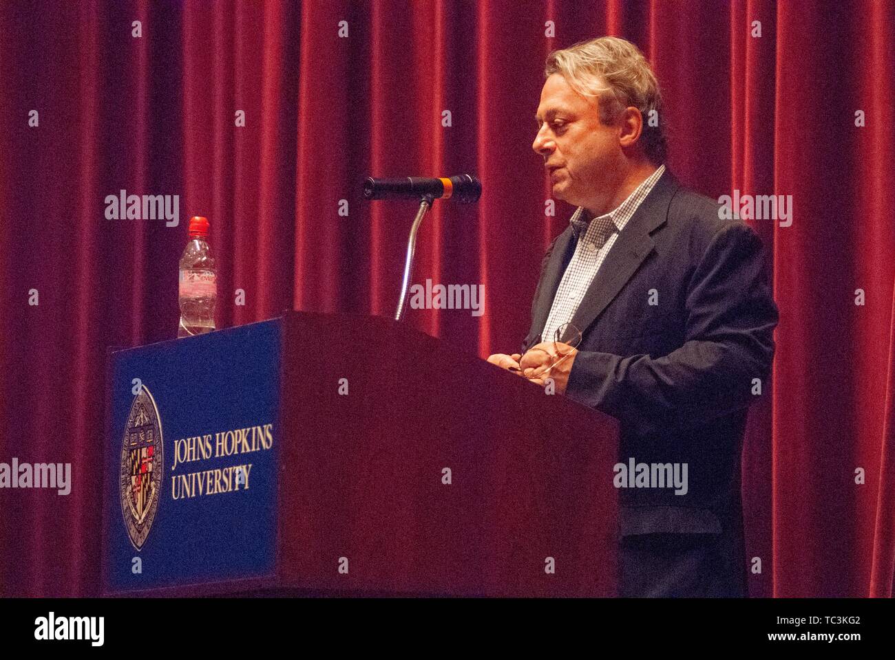 Profile shot of journalist Christopher Hitchens (1949 - 2011) speaking from a podium during a Milton S Eisenhower Symposium, Homewood Campus of Johns Hopkins University, Baltimore, Maryland, September 18, 2007. From the Homewood Photography Collection. () Stock Photo