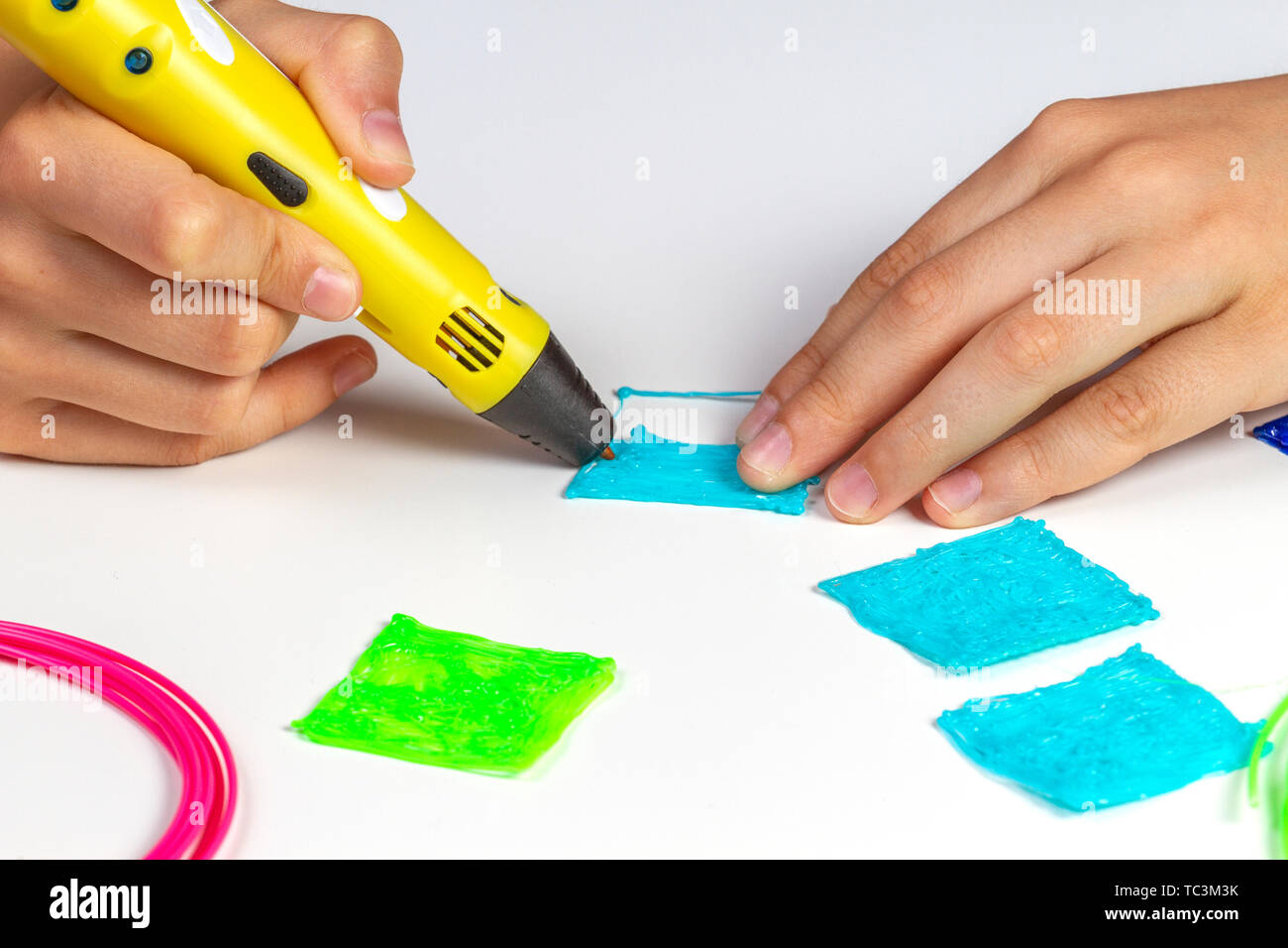 Boy hands creating with 3d printing pen new object Stock Photo - Alamy