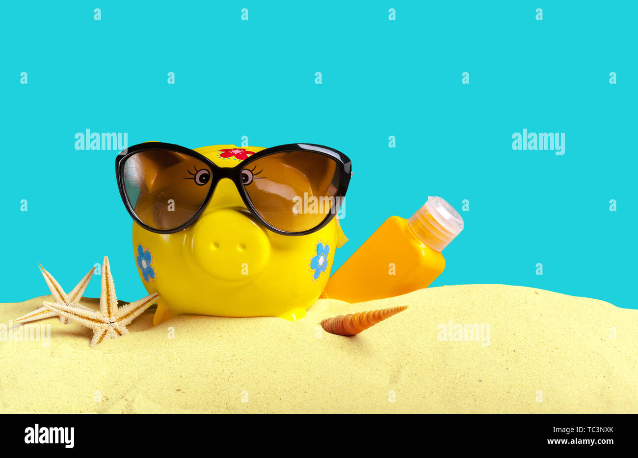 Summer piggy bank with sunglasses on the beach Stock Photo - Alamy