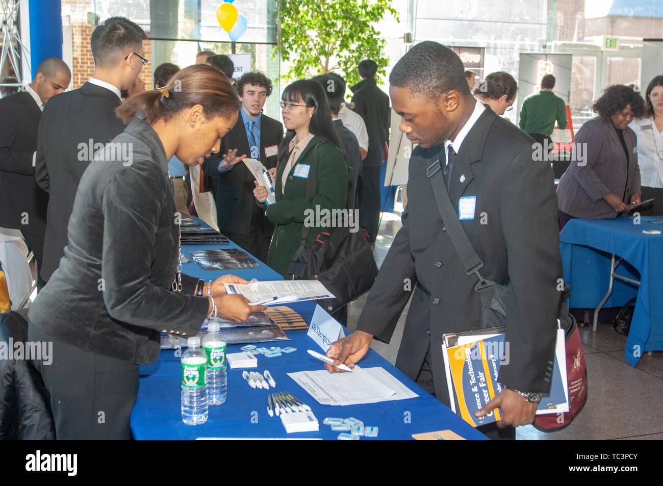 Students network with prospective employers at a Career Center fair at the Johns Hopkins University, Baltimore, Maryland, February 8, 2007. From the Homewood Photography Collection. () Stock Photo