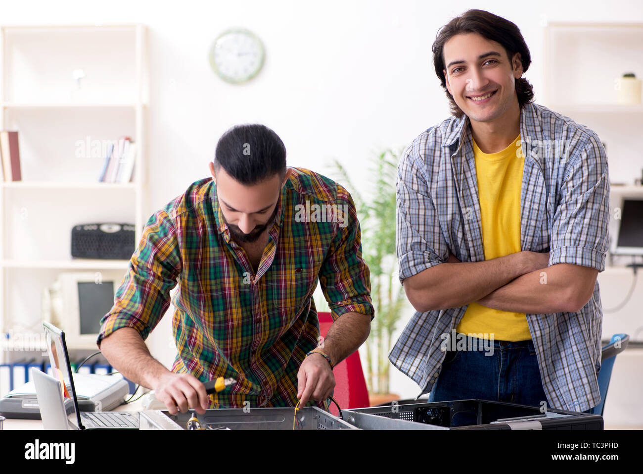 IT engineers working on hardware issue Stock Photo