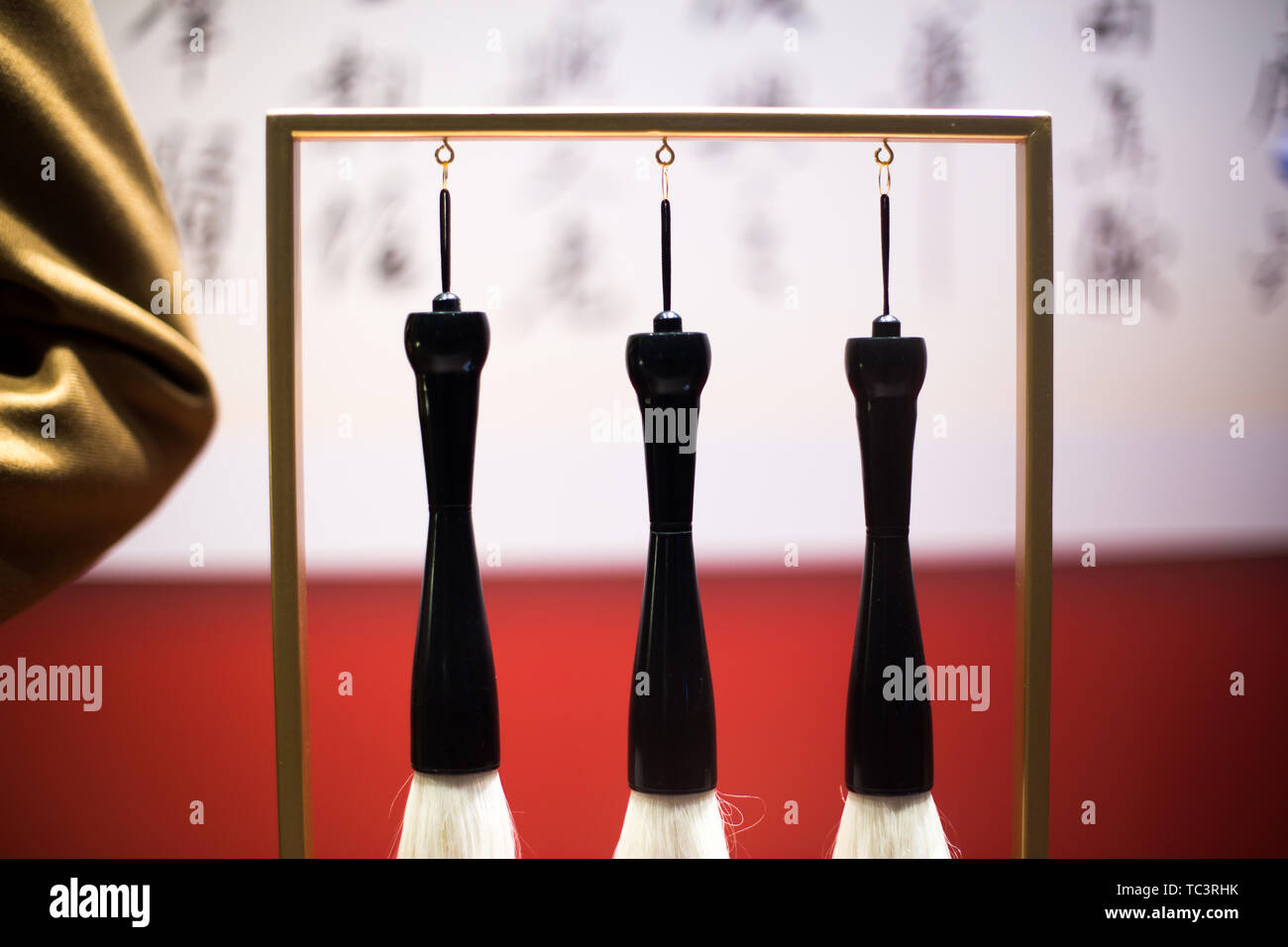 hanging calligraphy brushes on steel frame Stock Photo