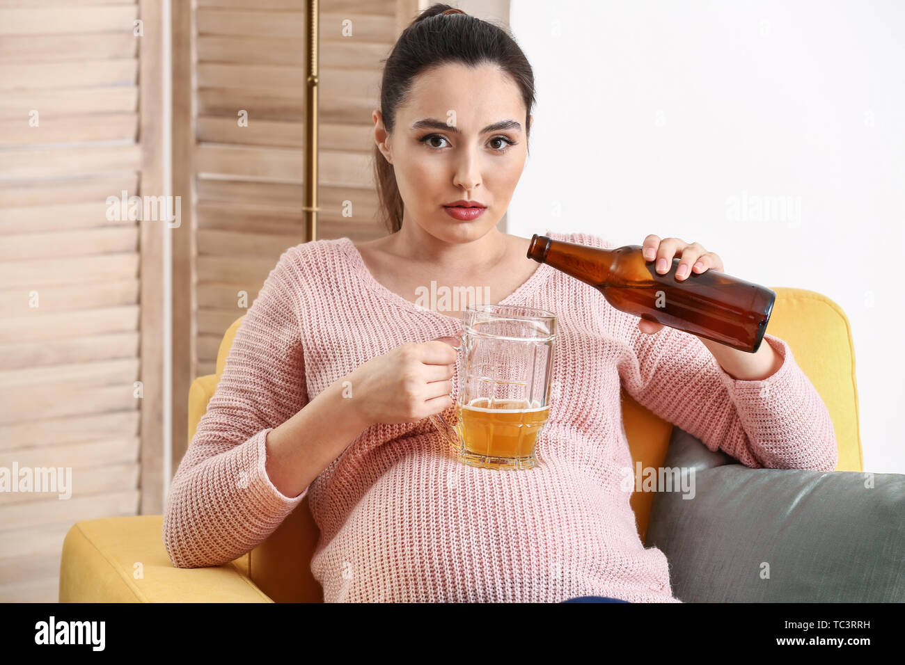 Pregnant woman drinking beer hires stock photography and images Alamy
