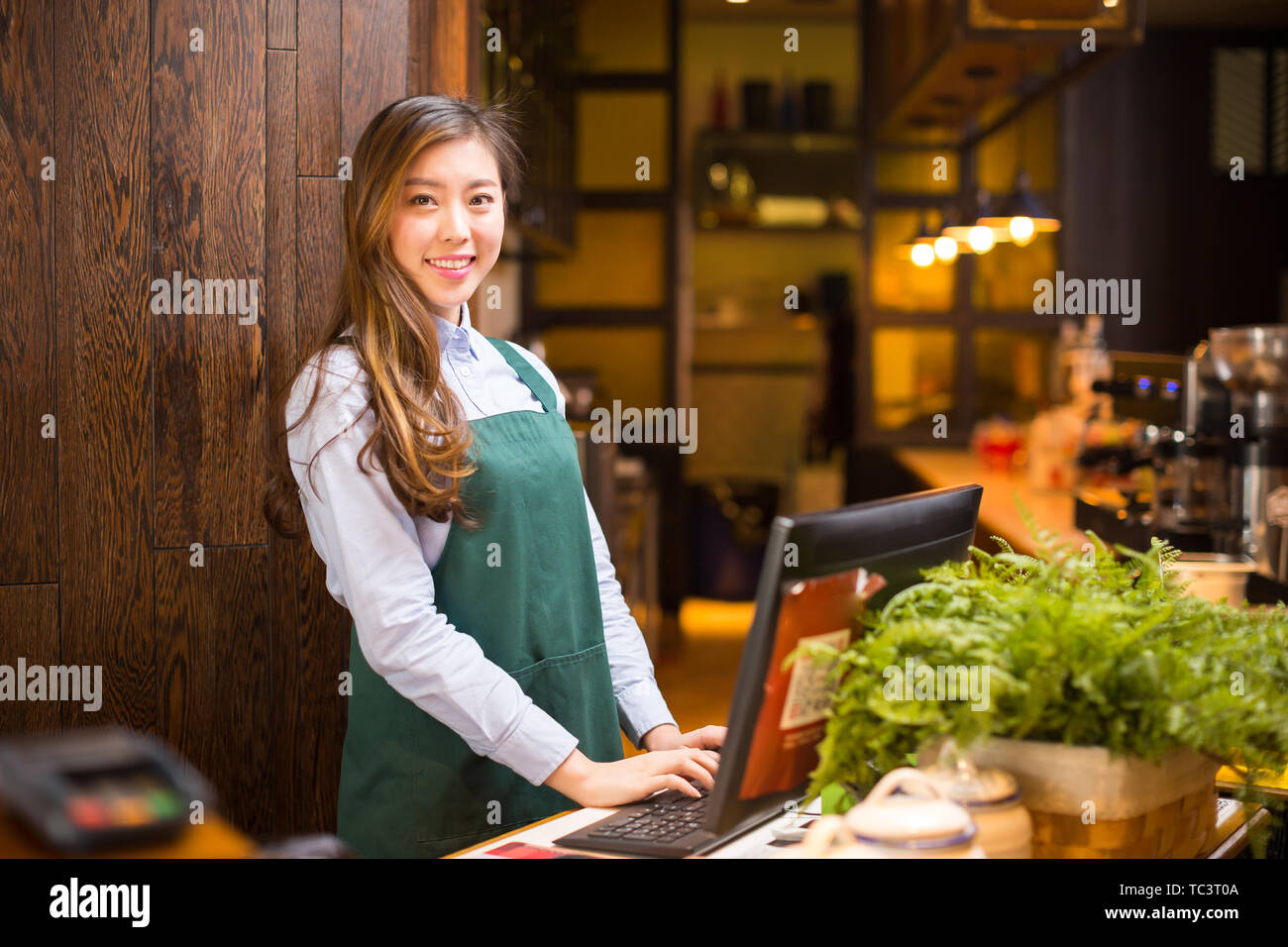 Make Waiters Make it waitress and waiter in cafe Stock Photo - Alamy
