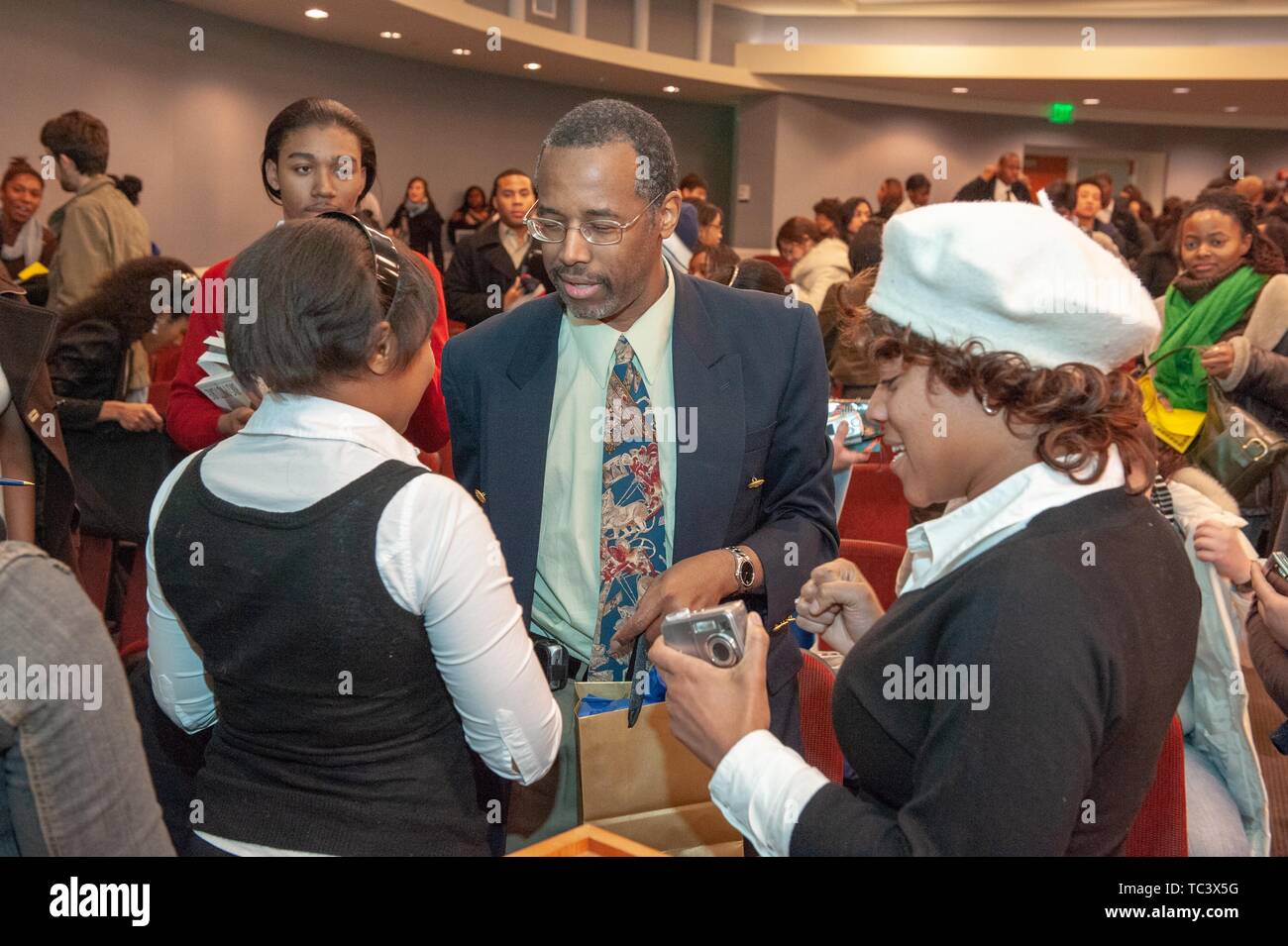 Neurosurgeon Ben Carson chats with attendees during the Minority Pre-Health Conference at the Johns Hopkins University, Baltimore, Maryland, March, 2008. From the Homewood Photography Collection. () Stock Photo