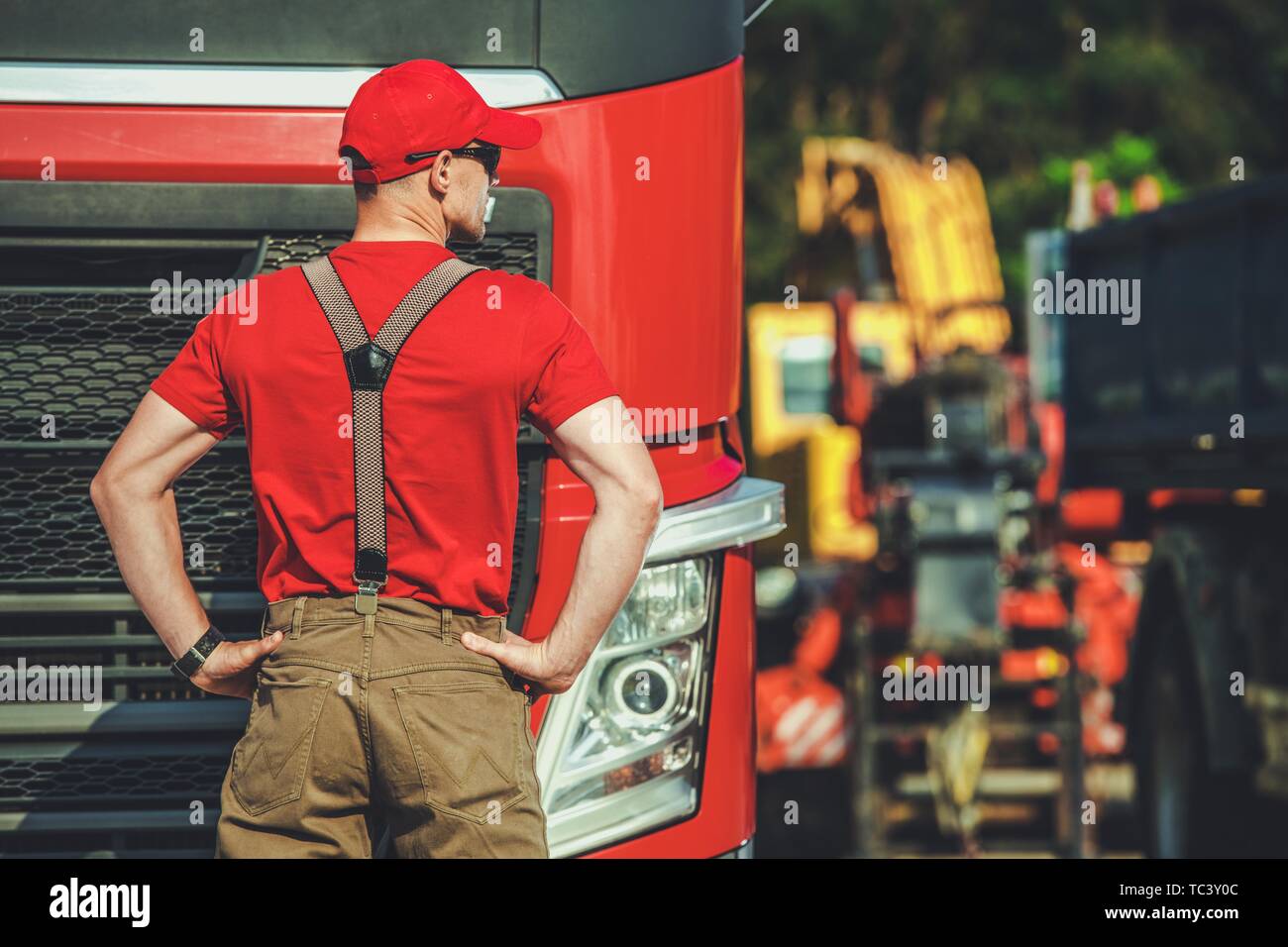 Semi Truck Driver in His 30s. Euro Transportation Concept. Transport Industry. Stock Photo