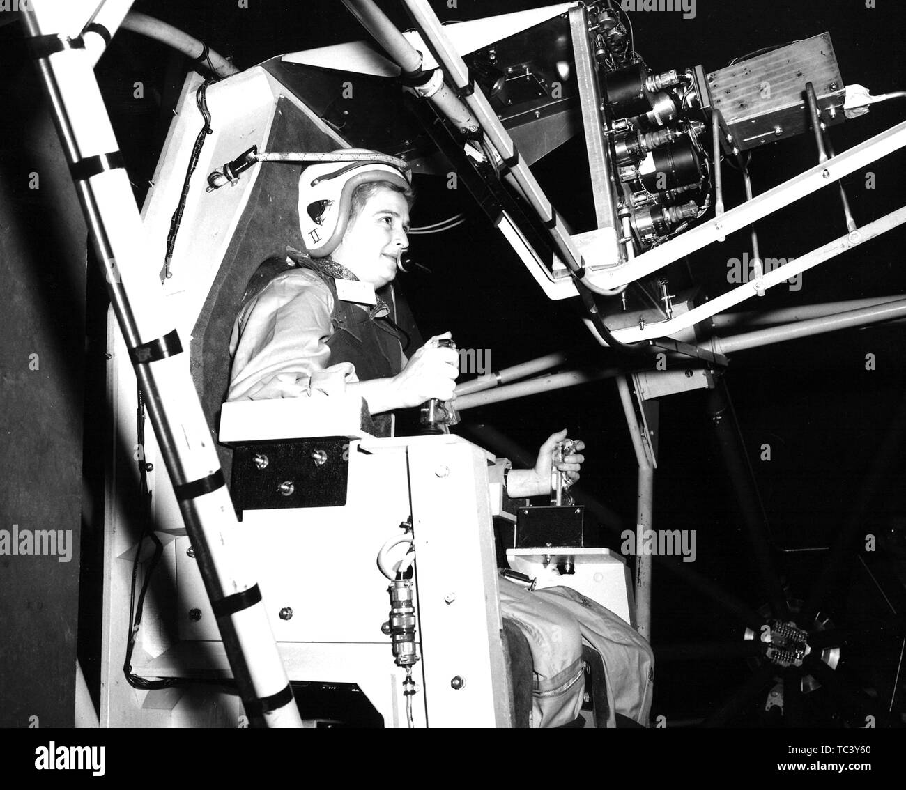 Female pilot Jerrie Cobb (1931 - 2019) tests the Gimbal Rig in the Altitude Wind Tunnel at the Lewis Research Center in Cleveland, Ohio, April 6, 1960. Image courtesy National Aeronautics and Space Administration (NASA). () Stock Photo