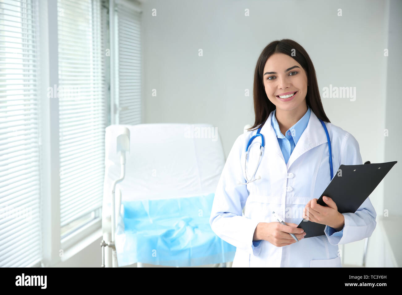 Beautiful female gynecologist in clinic Stock Photo - Alamy