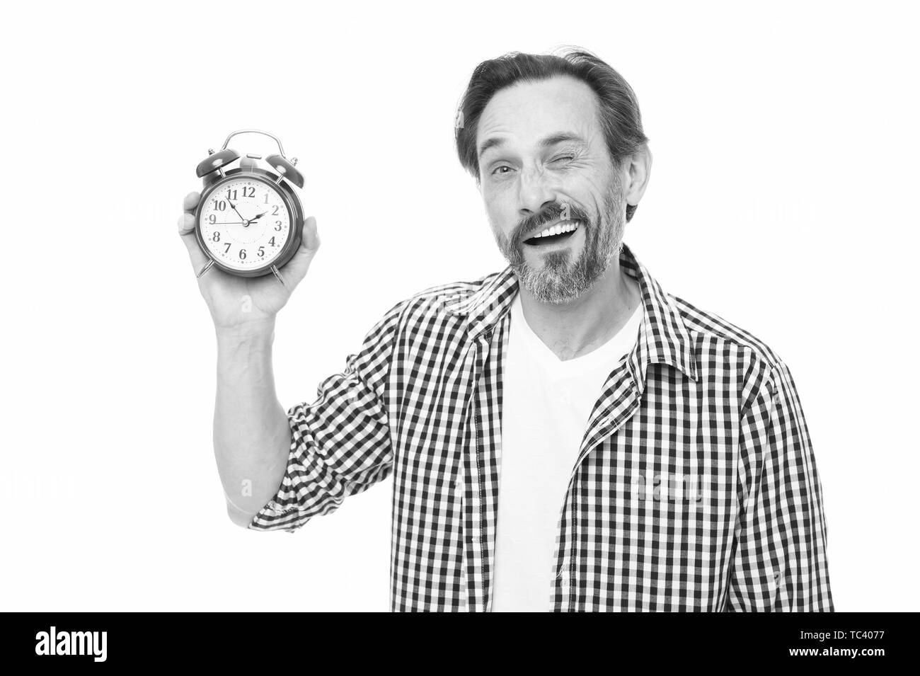 What time is it. Bearded senior man with mechanical clock in hand ...