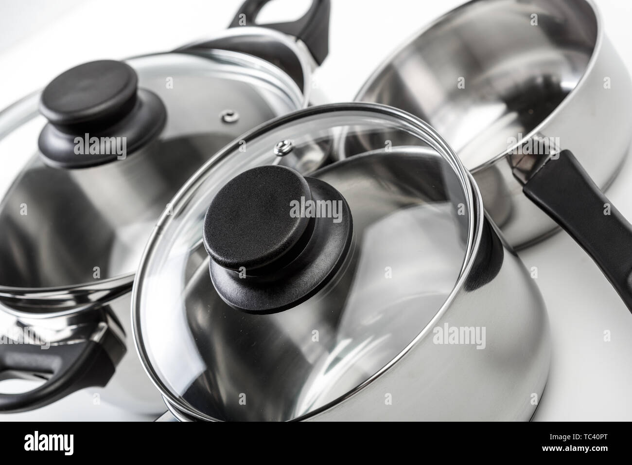 Stainless steel pots and pans isolated on white Stock Photo Alamy