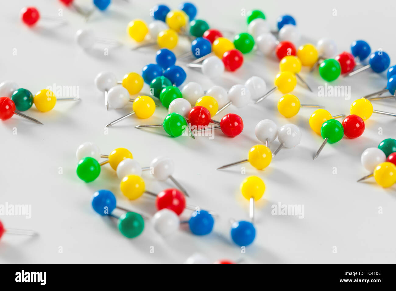 colorful color push pins isolated on white background Stock Photo - Alamy