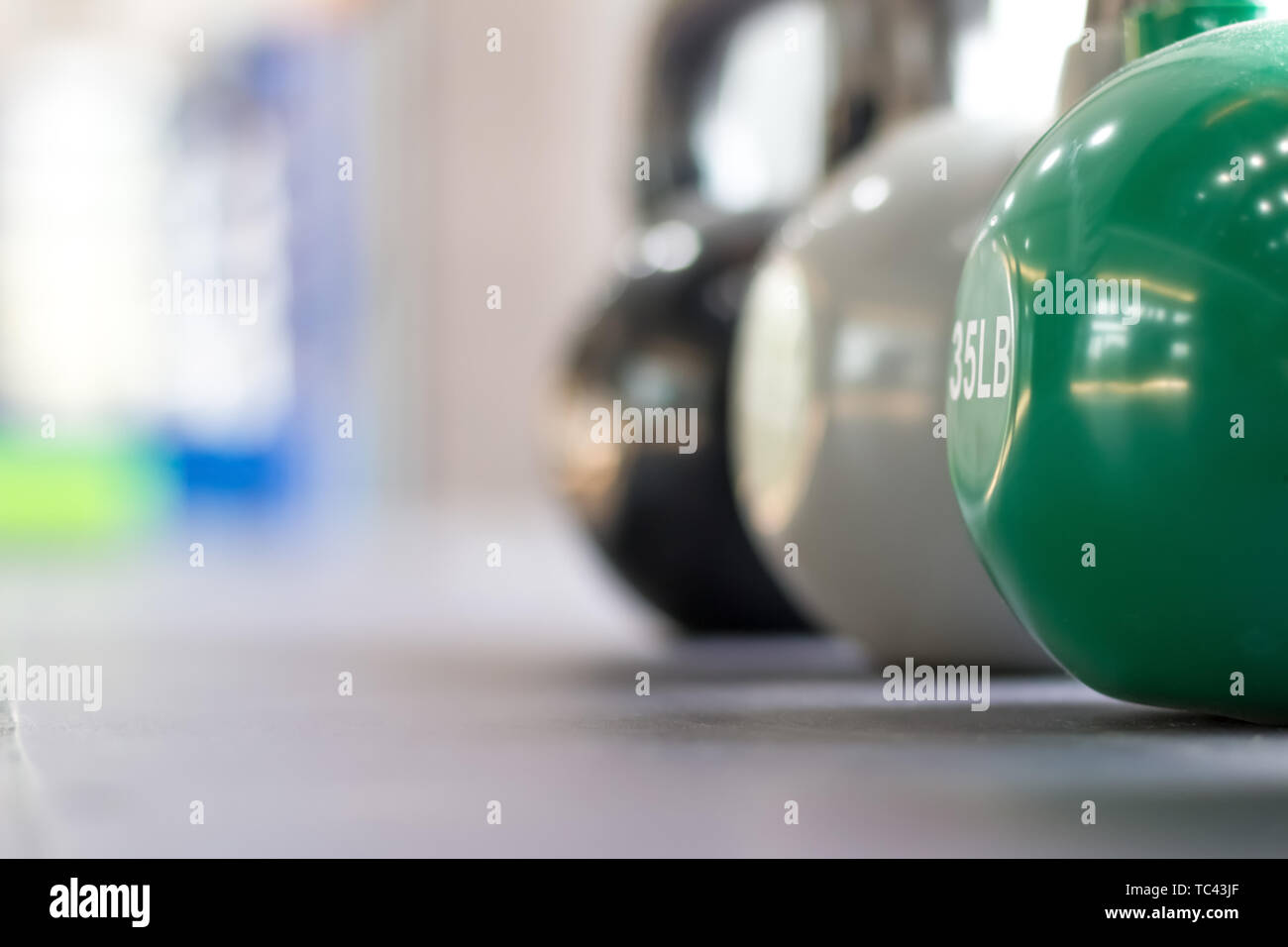 Colorful kettle bell on table Stock Photo