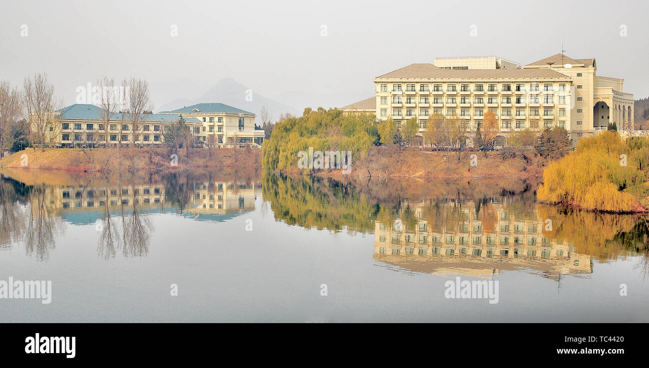 Architecture and reflection of houses on the shores of Yanqi Lake in Beijing Stock Photo
