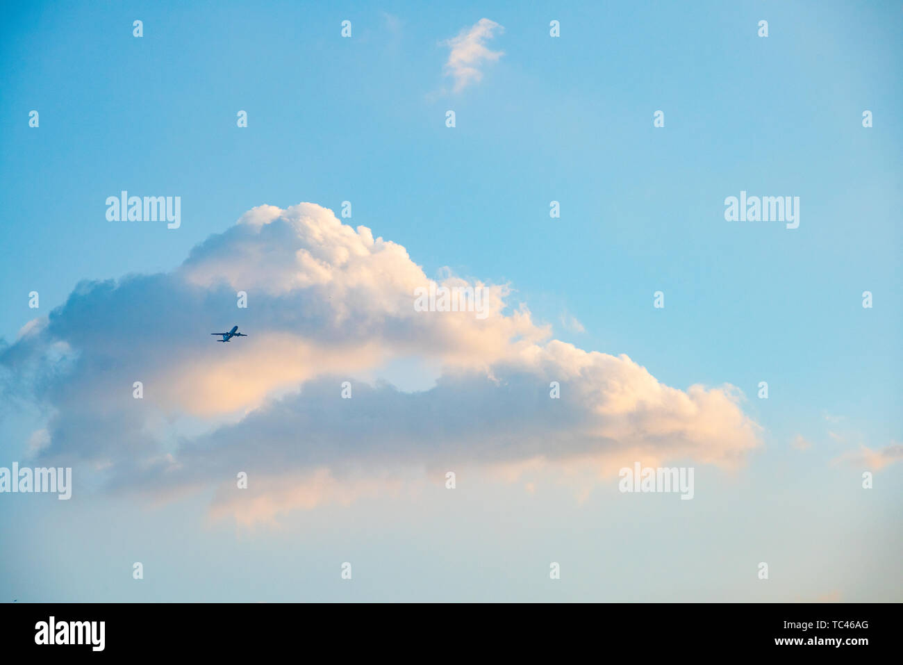 Aircraft in the sea of clouds Stock Photo