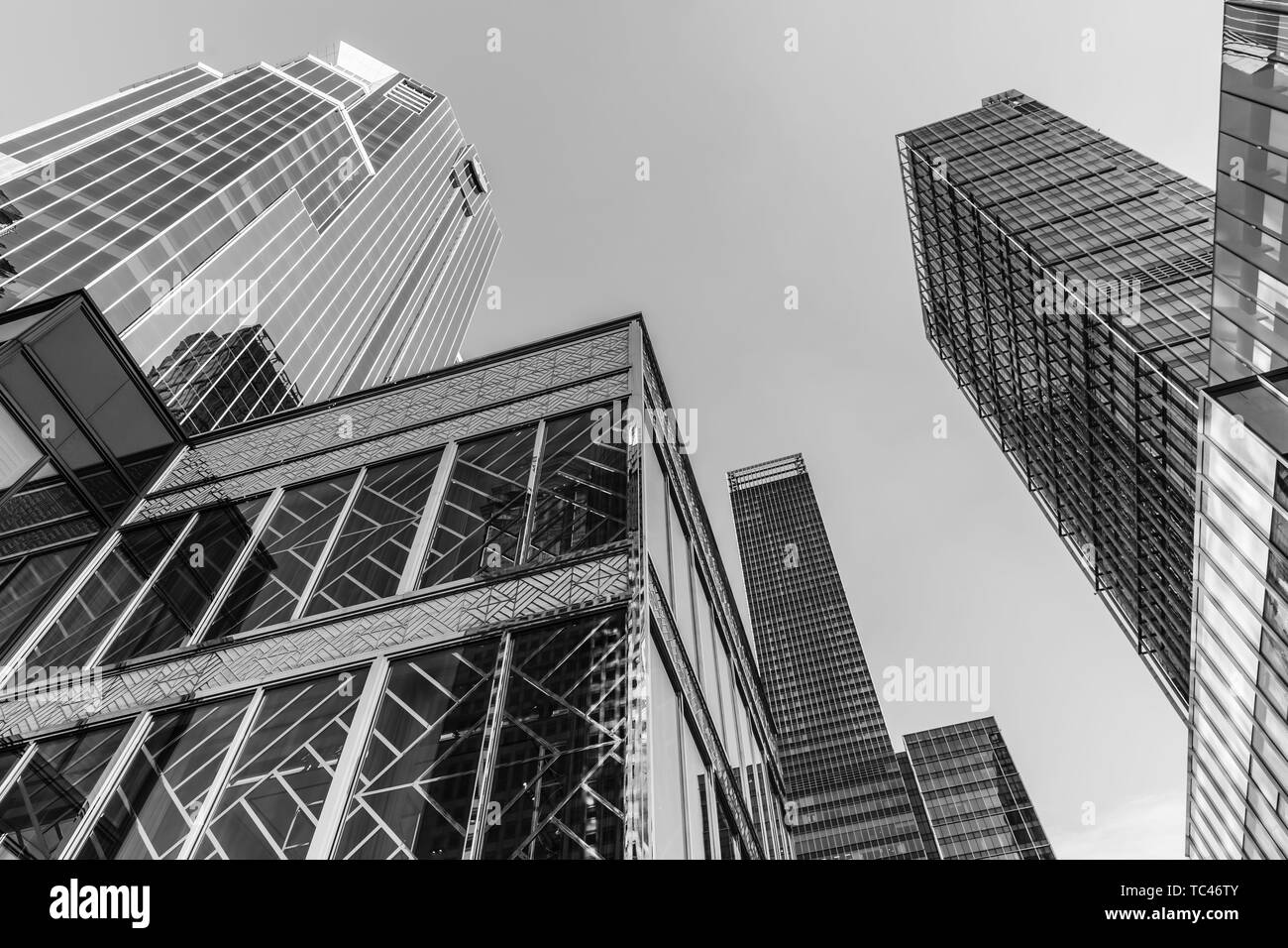 Skyscrapers, buildings, offices, glass and city windows, high commercial buildings in the city center, black and white, modern city appearance reflection perspective view view of skyline no one in the sky and the city's steel Stock Photo