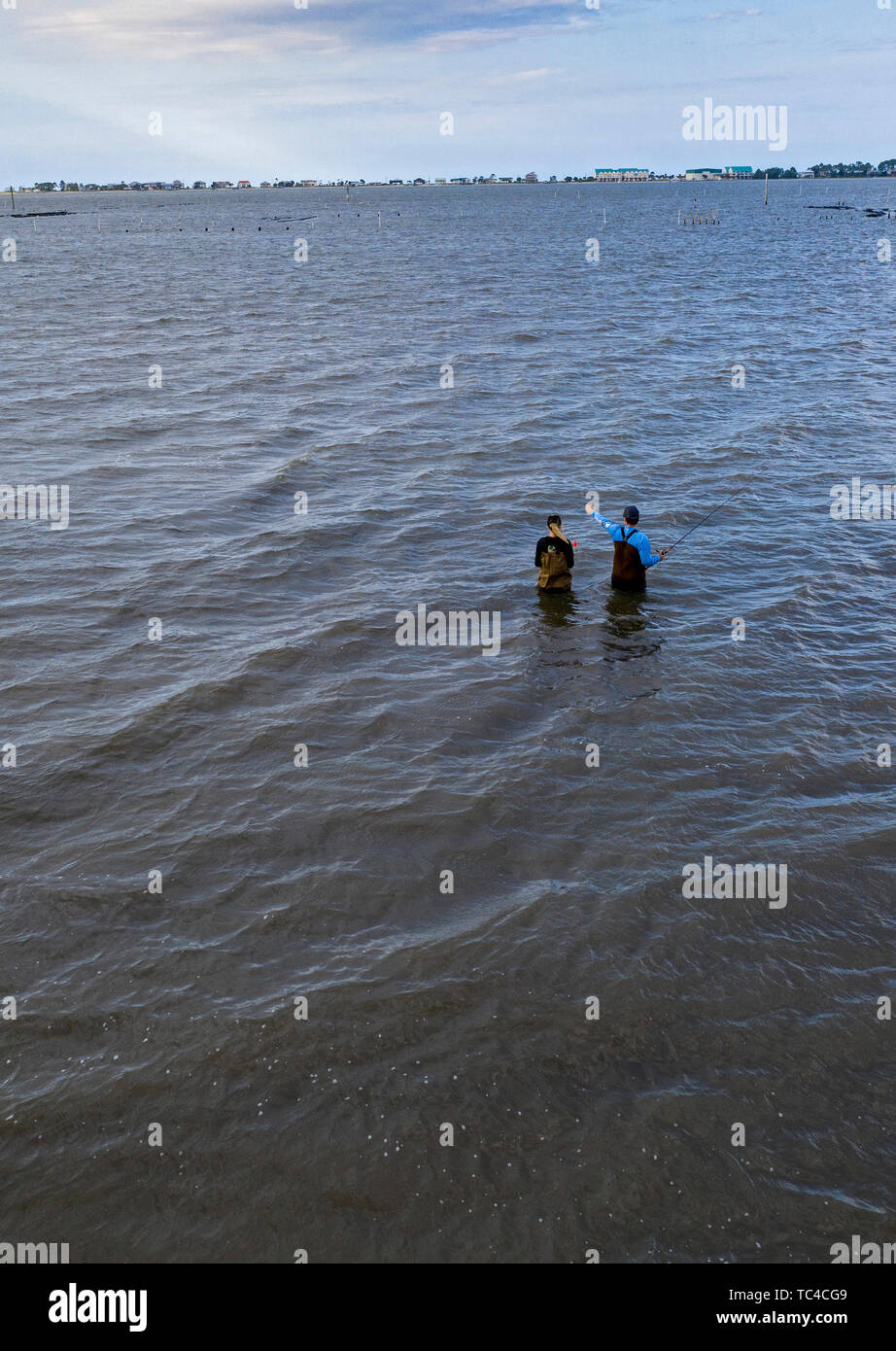 Alligator Point, Florida - Two people fish in Alligator Harbor on the Gulf of Mexico. Stock Photo