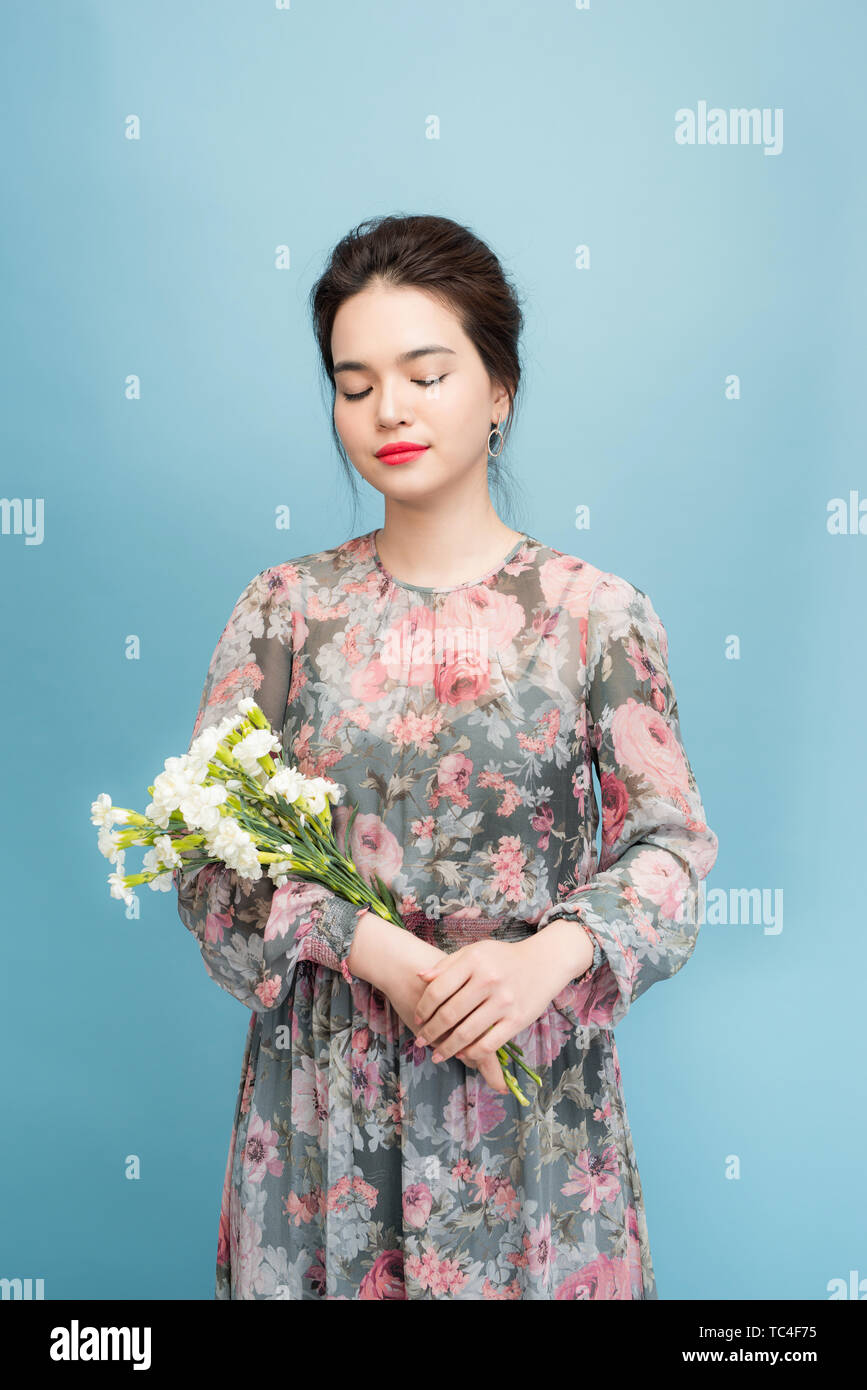 Beautiful elegant woman wearing flower dress Stock Photo - Alamy