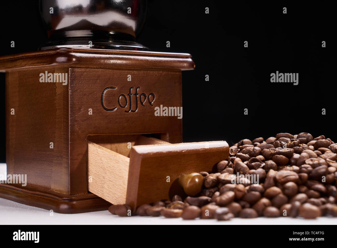 Handmade bean grinders and coffee beans Stock Photo Alamy
