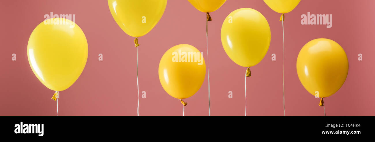 Yellow Bright Balloons On Pink Background Party Decoration