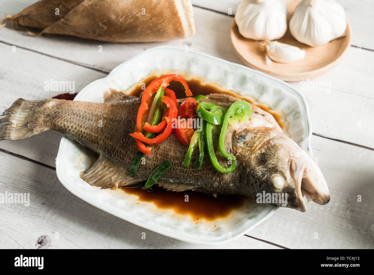 Steamed sea bass, traditional Cantonese cuisine Stock Photo Alamy