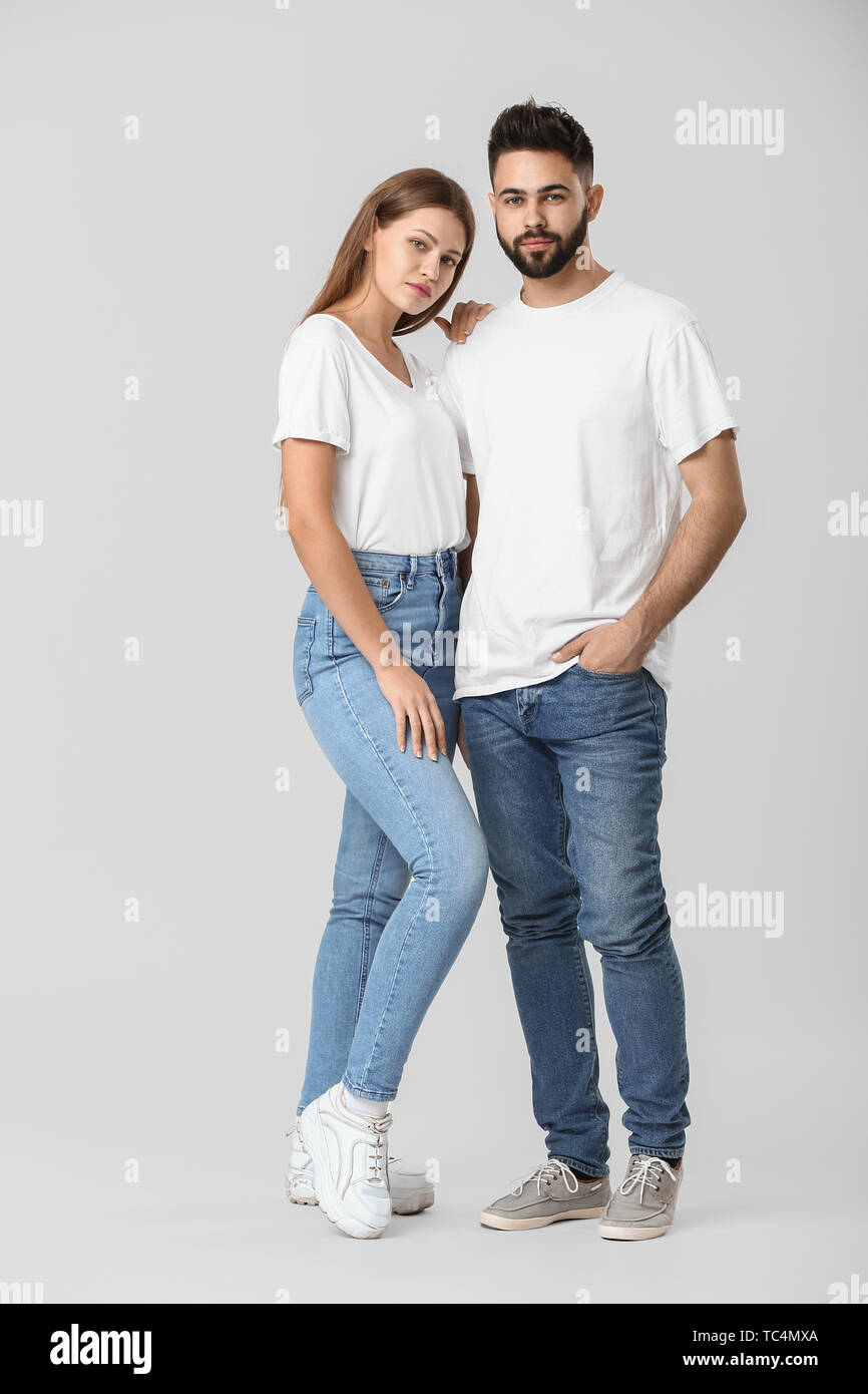 Terminologie kraam Belichamen Stylish young couple in jeans on white background Stock Photo - Alamy