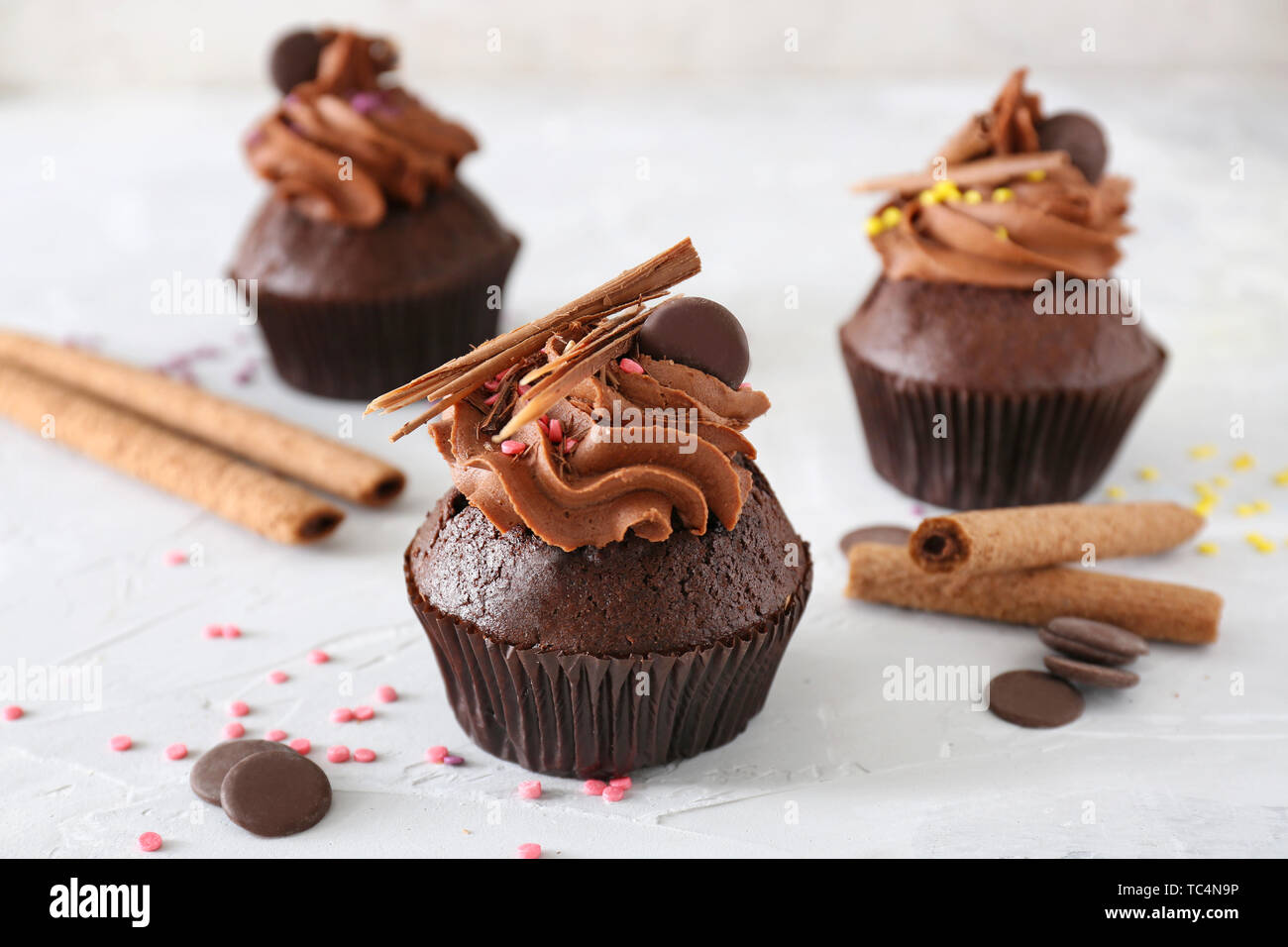 Tasty chocolate cupcakes on light background Stock Photo