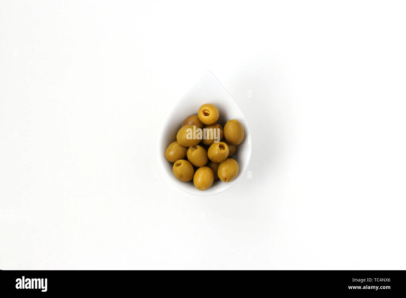 Olives without pits in a white plate isolated on white background