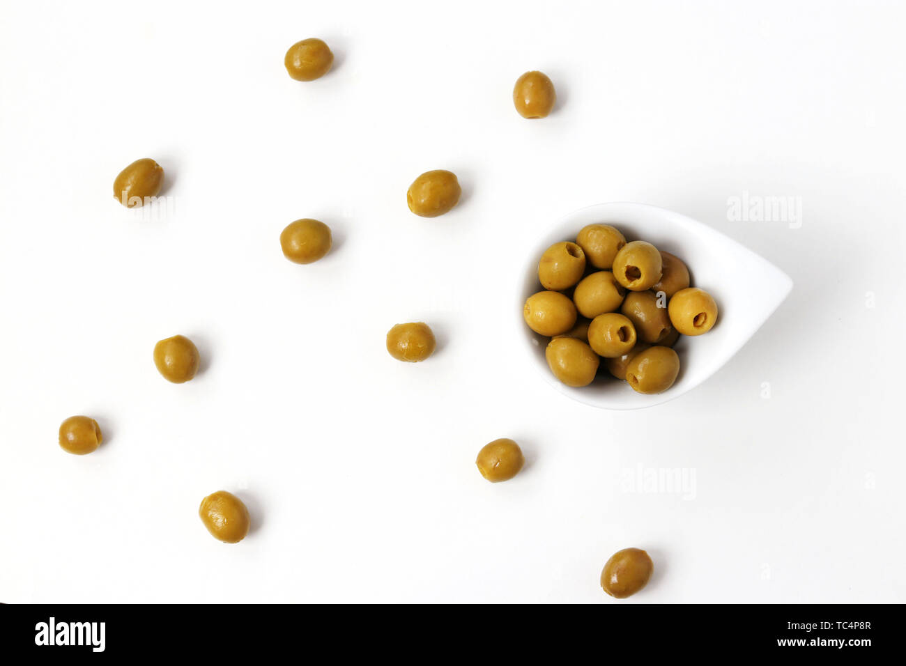 Olives without pits in a white plate isolated on white background
