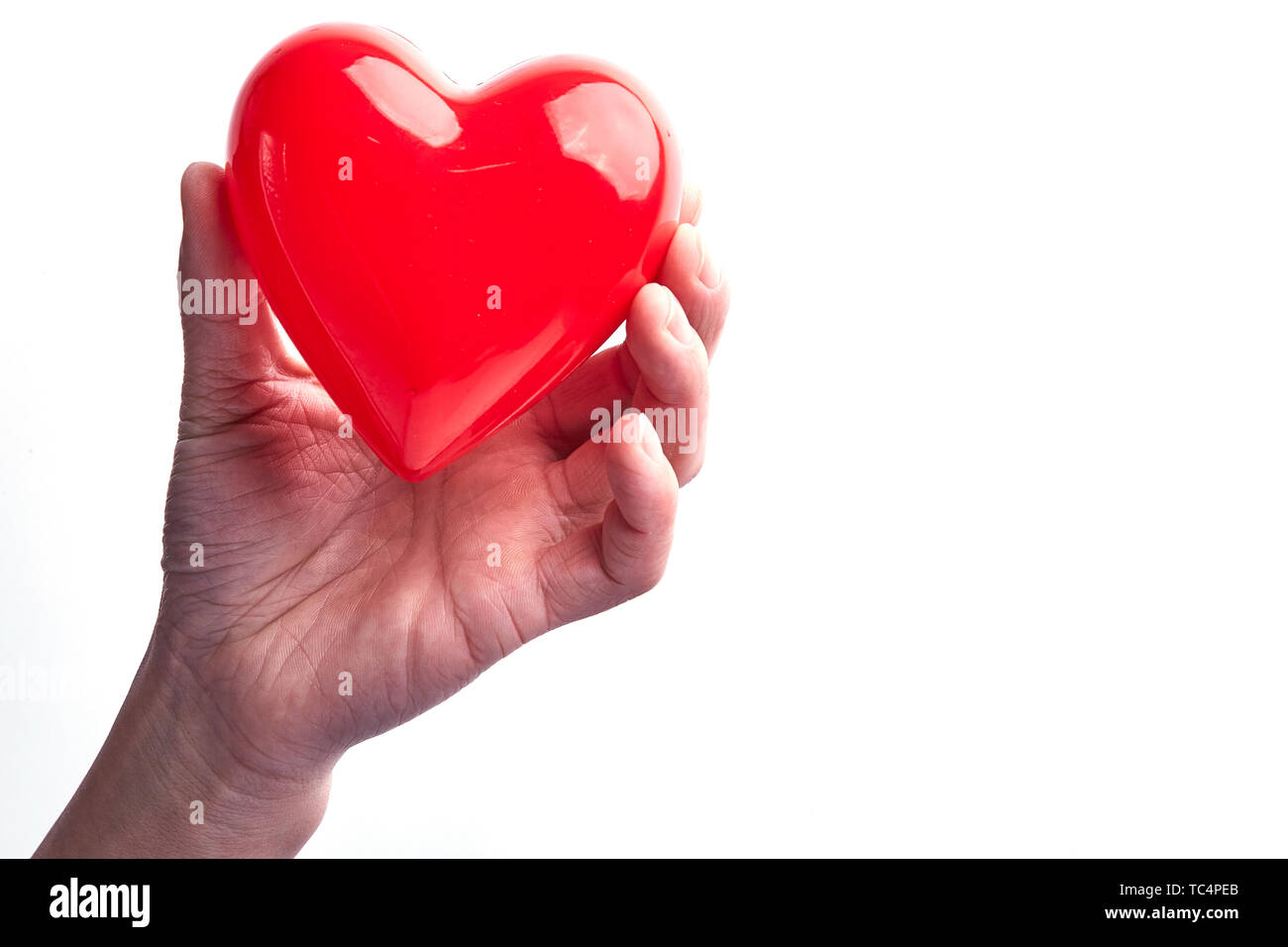 Hands holding red love hearts Stock Photo - Alamy
