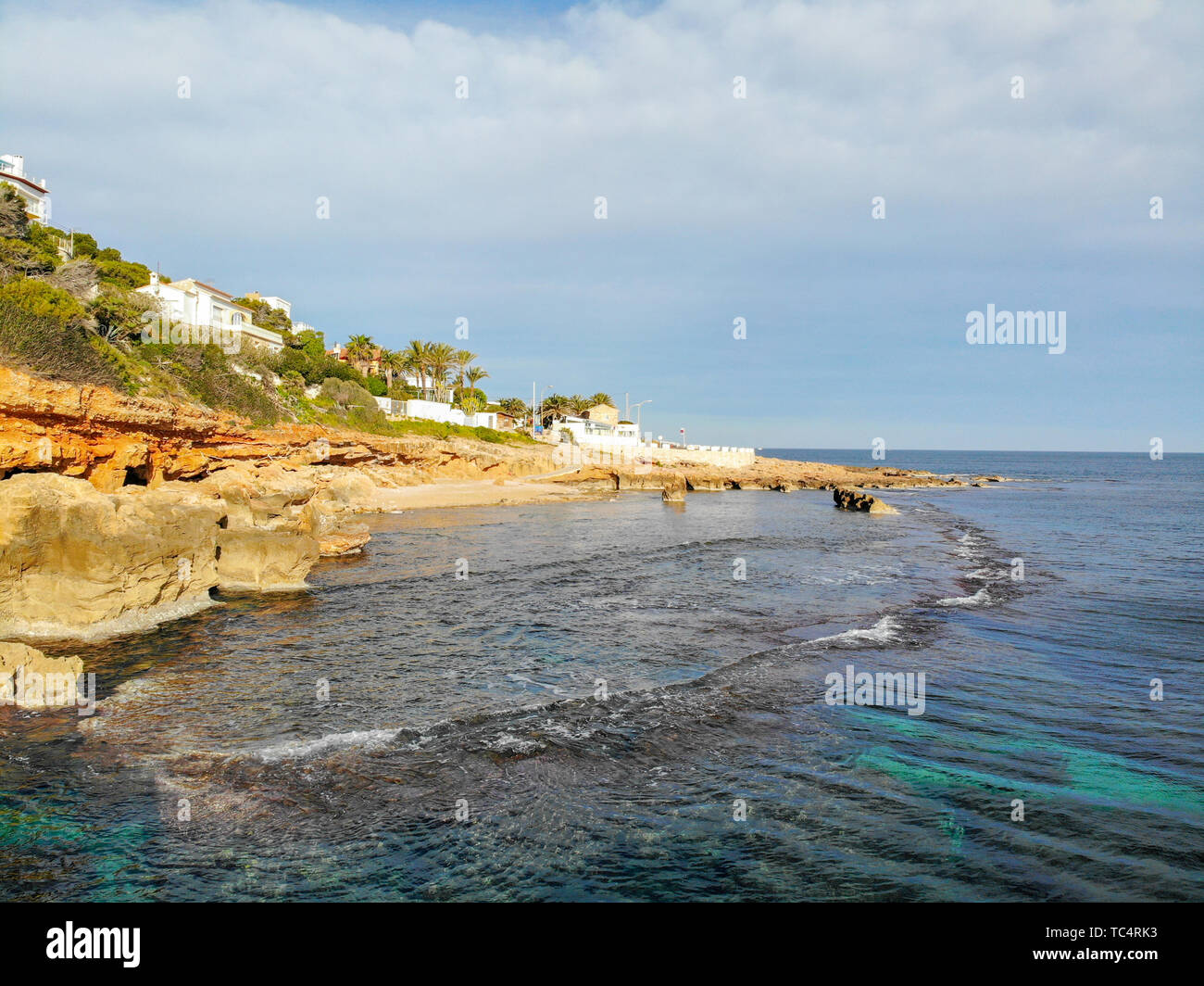 Aerial view of Las Rotas rocky beach in Denia, Spain at sunset Stock