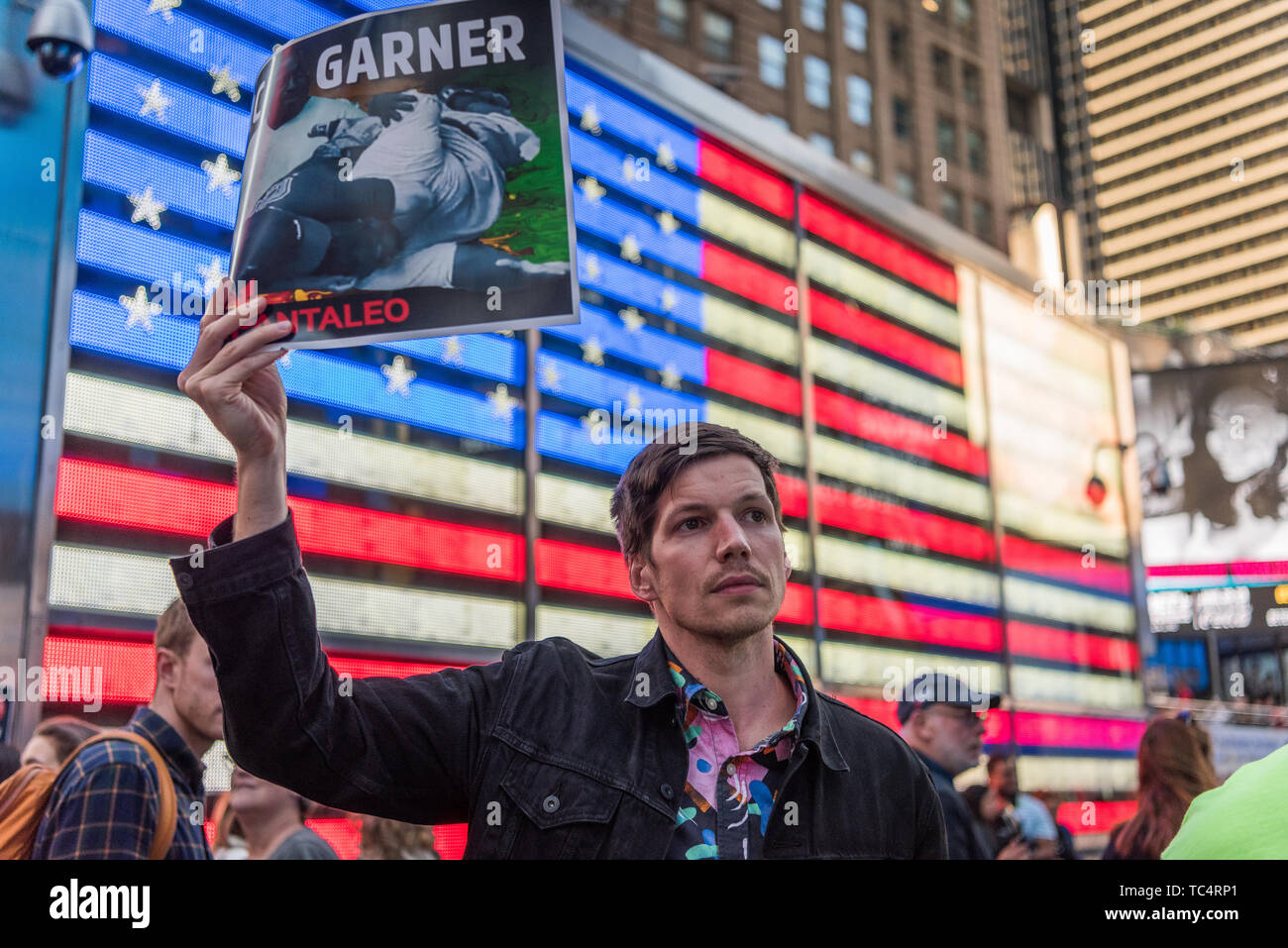 New York, United States. 04th June, 2019. Protesters rallied in Times Square in New York City demanding the firing of Officer Pantaleo for the choking death of Eric Garner in 2014. Daniel Pantaleo is currently standing administrative trial which began on May 13. On May 21, the judge overseeing his case delayed the remainder of the hearing until June 5, 2019. Pantaleo has been on desk duty since Eric Garner's death and could face penalties ranging from loss of vacation days to firing from the NYPD. Credit: Gabriele Holtermann-Gorden/Pacific Press/Alamy Live News Stock Photo