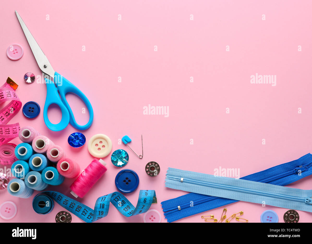 Set of sewing threads and accessories on color background Stock Photo ...