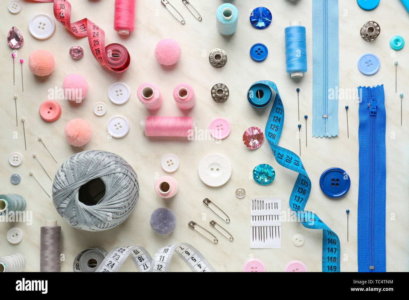 Set of sewing threads and accessories on light background Stock Photo ...
