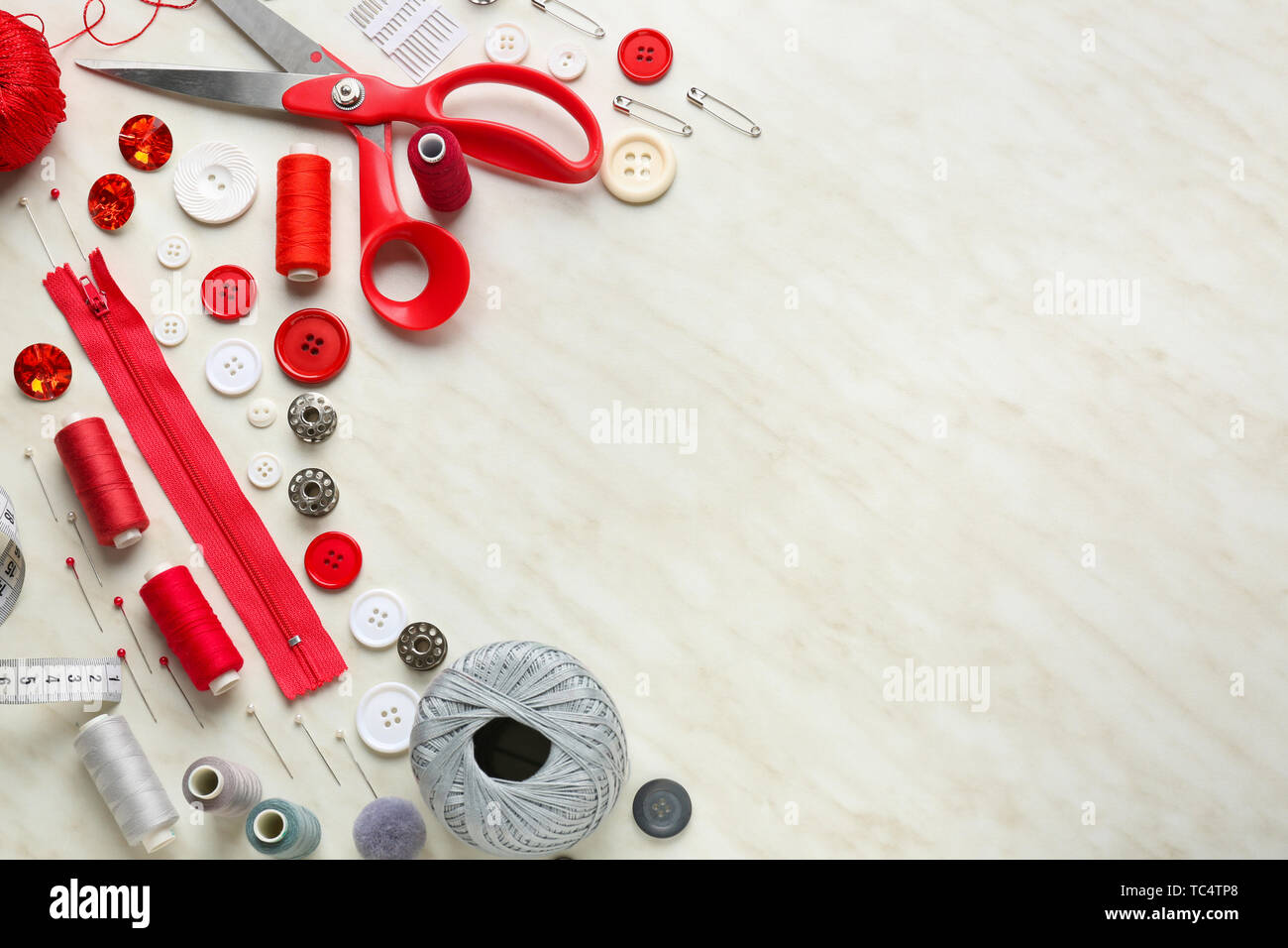 Set of sewing threads and accessories on light background Stock Photo ...