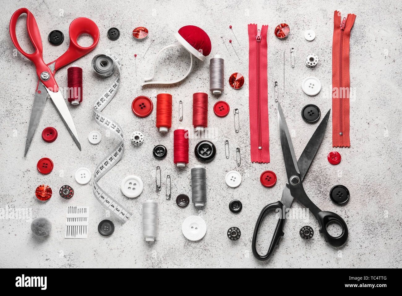 Set of sewing threads and accessories on light background Stock Photo ...