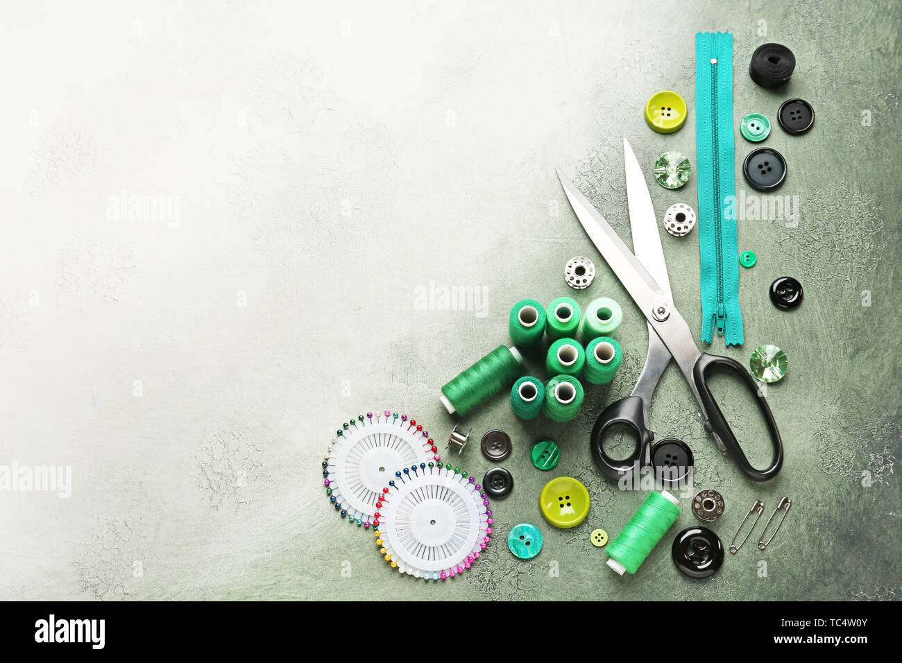 Set of sewing threads and accessories on color background Stock Photo ...