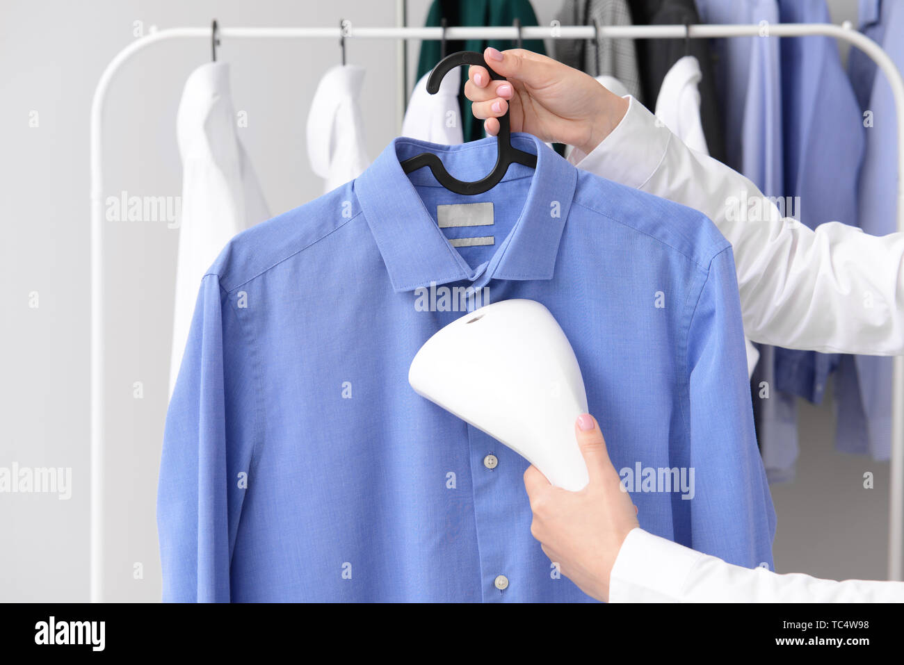 Dry cleaner clothes rail hires stock photography and images Alamy