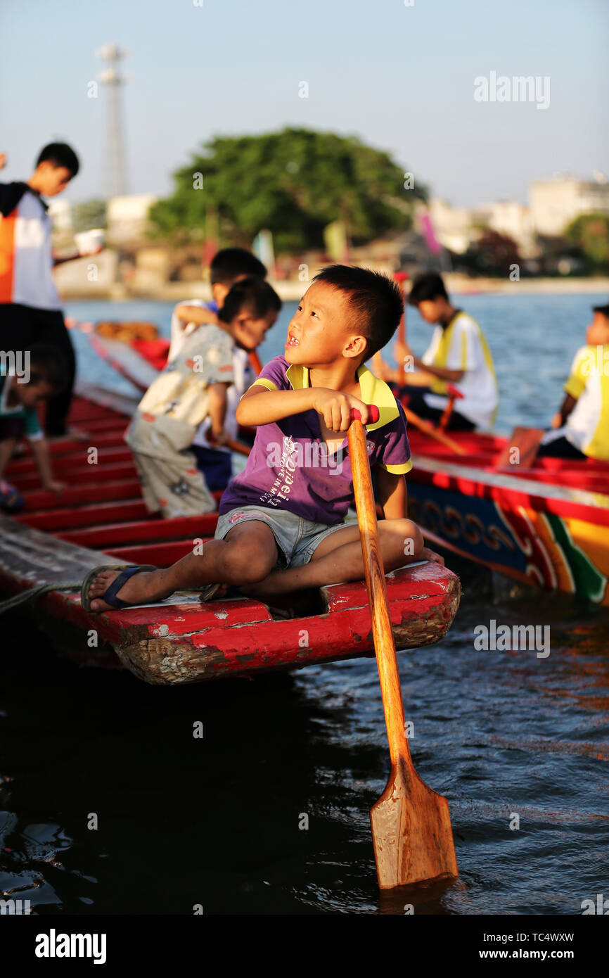 Dragon Boat Festival, dragon boatpaddling child Stock Photo Alamy