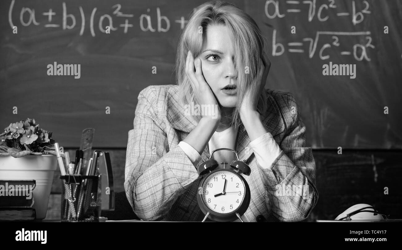 time management. teacher with alarm clock at blackboard. Time. Study