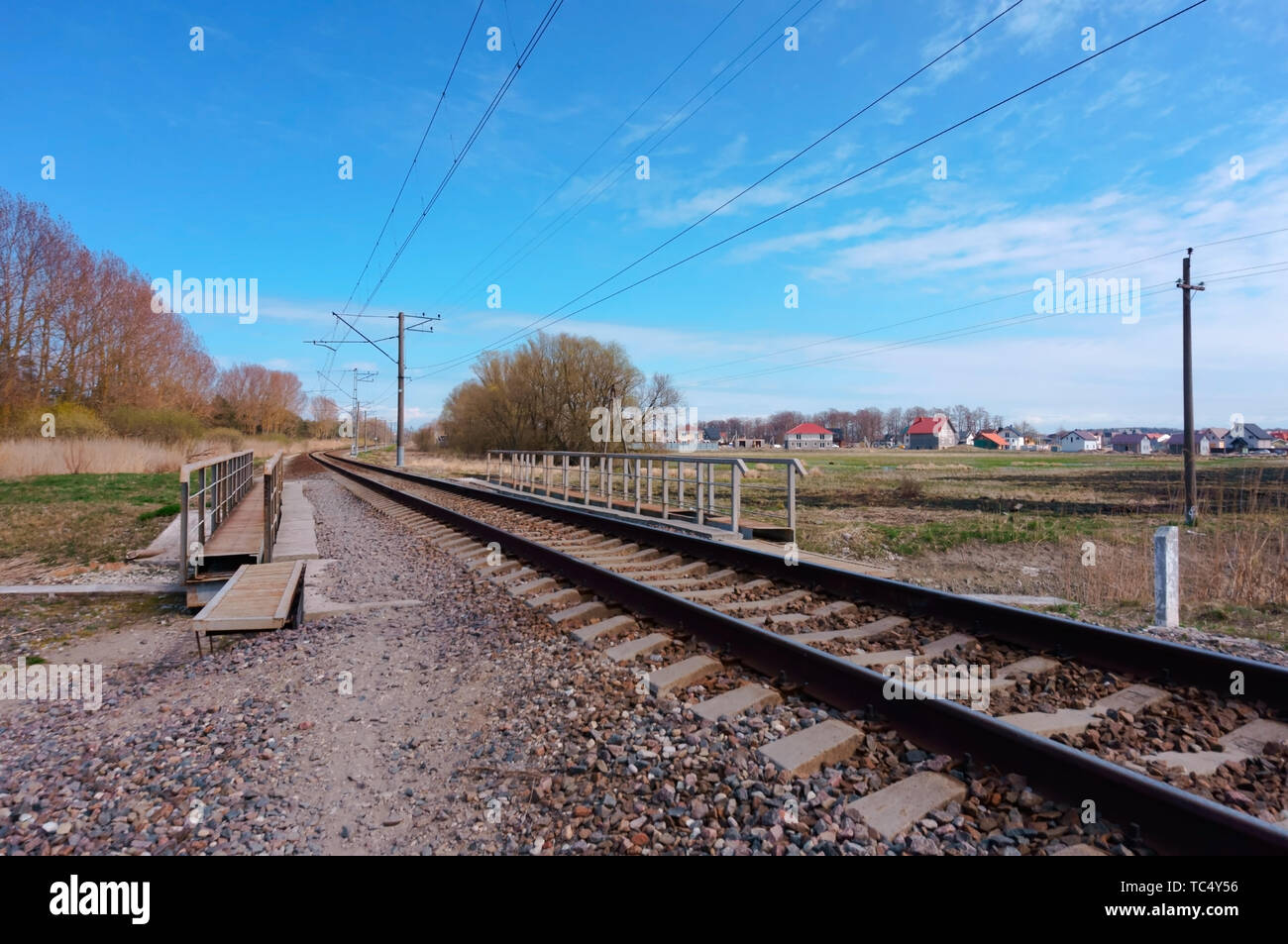 railway stretching into the distance, rails in three rows Stock Photo