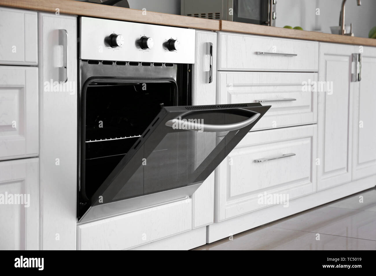 Modern open oven in kitchen Stock Photo Alamy