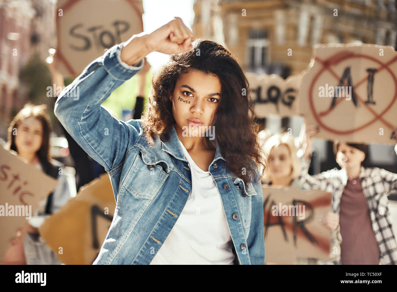 The power of a woman Young and strong woman is protesting for women
