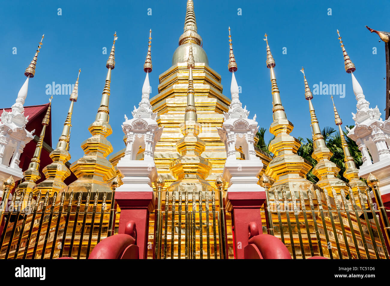 A shot looking across to the detailed ornate gold design of the beautiful Thai Temple Wat Phantao in Chiang Mai Thailand. Stock Photo