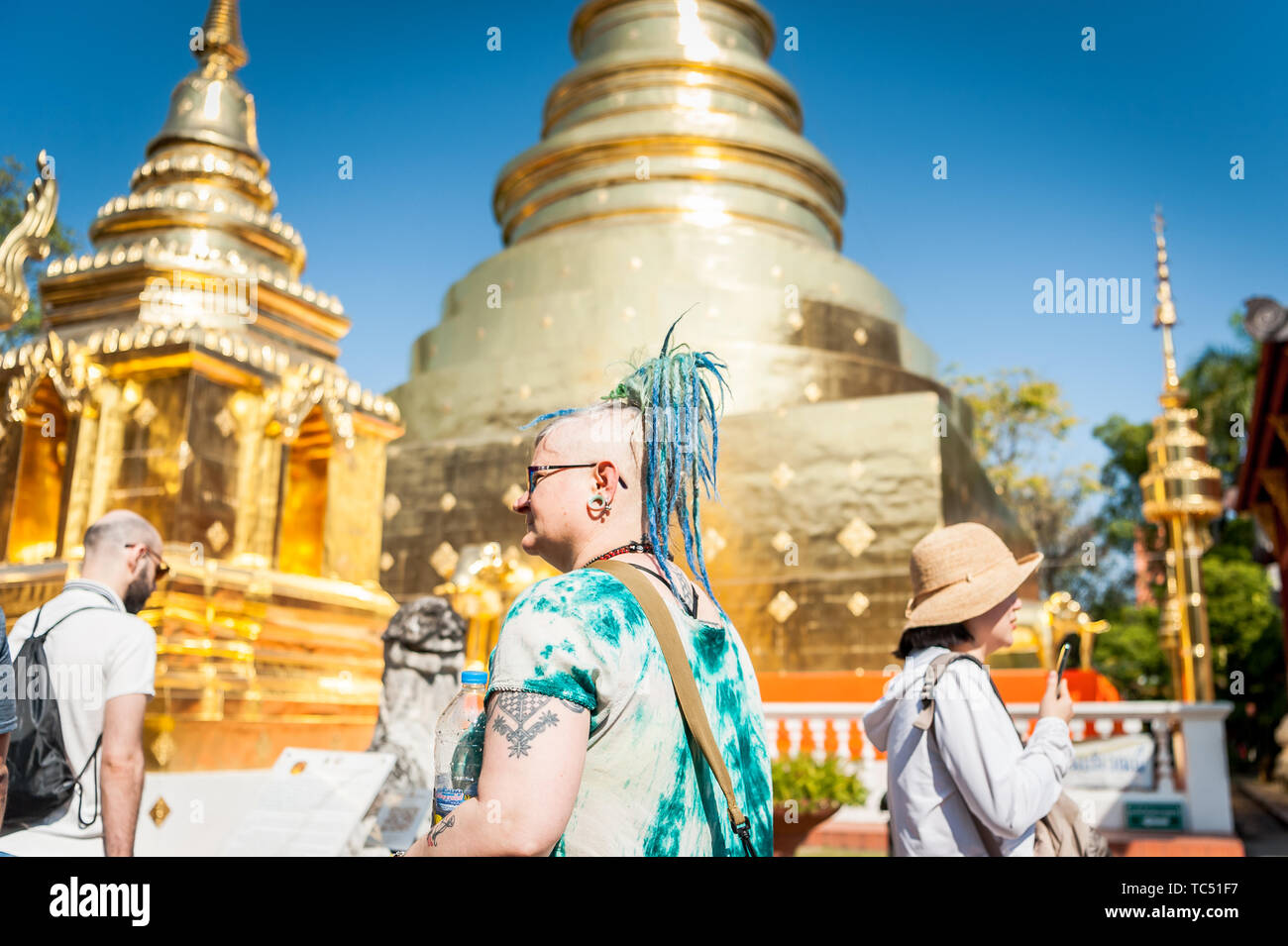 Tourists enjoy the incredible beauty of Wat Phra Sing Temple in Chiang Mai, Thailand. Stock Photo