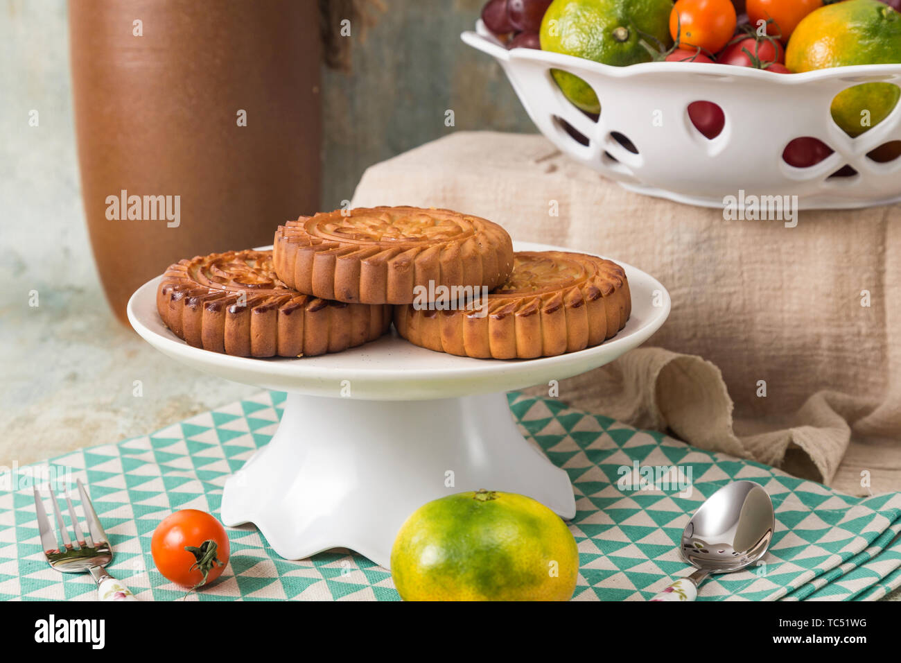 Moon cakes and fruit on the table Stock Photo
