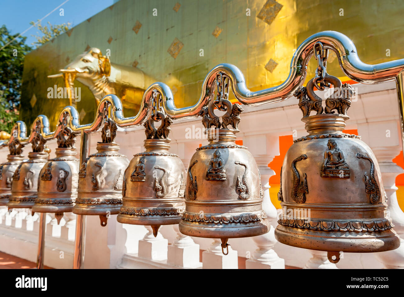 Ringing bells at the Wat Phra Singh Woramahavikarn Buddhist Temple Chiang Mai Thailand. Stock Photo