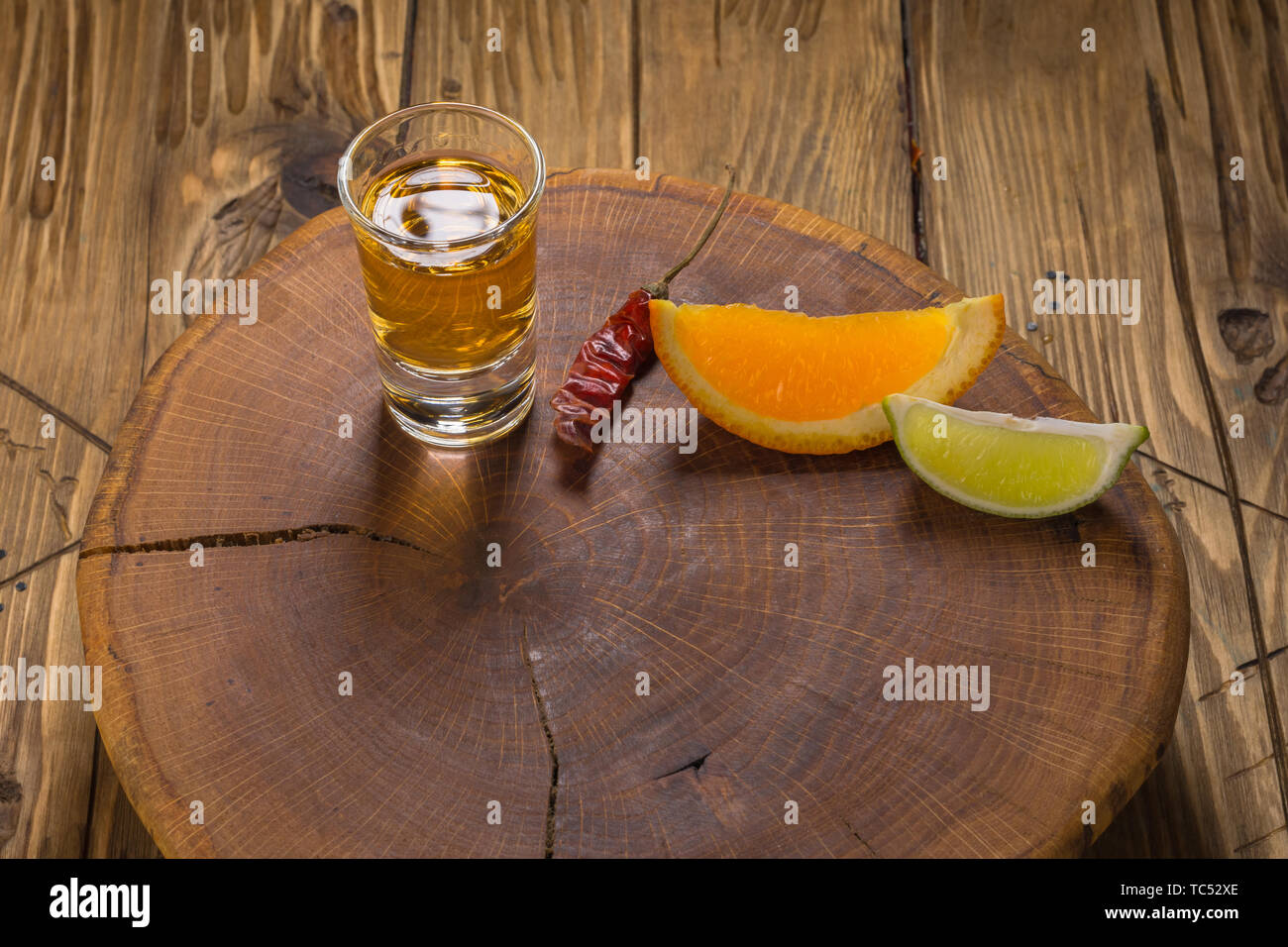 Mezcal shot mexican drink with orange and lime slices, chili in oaxaca ...